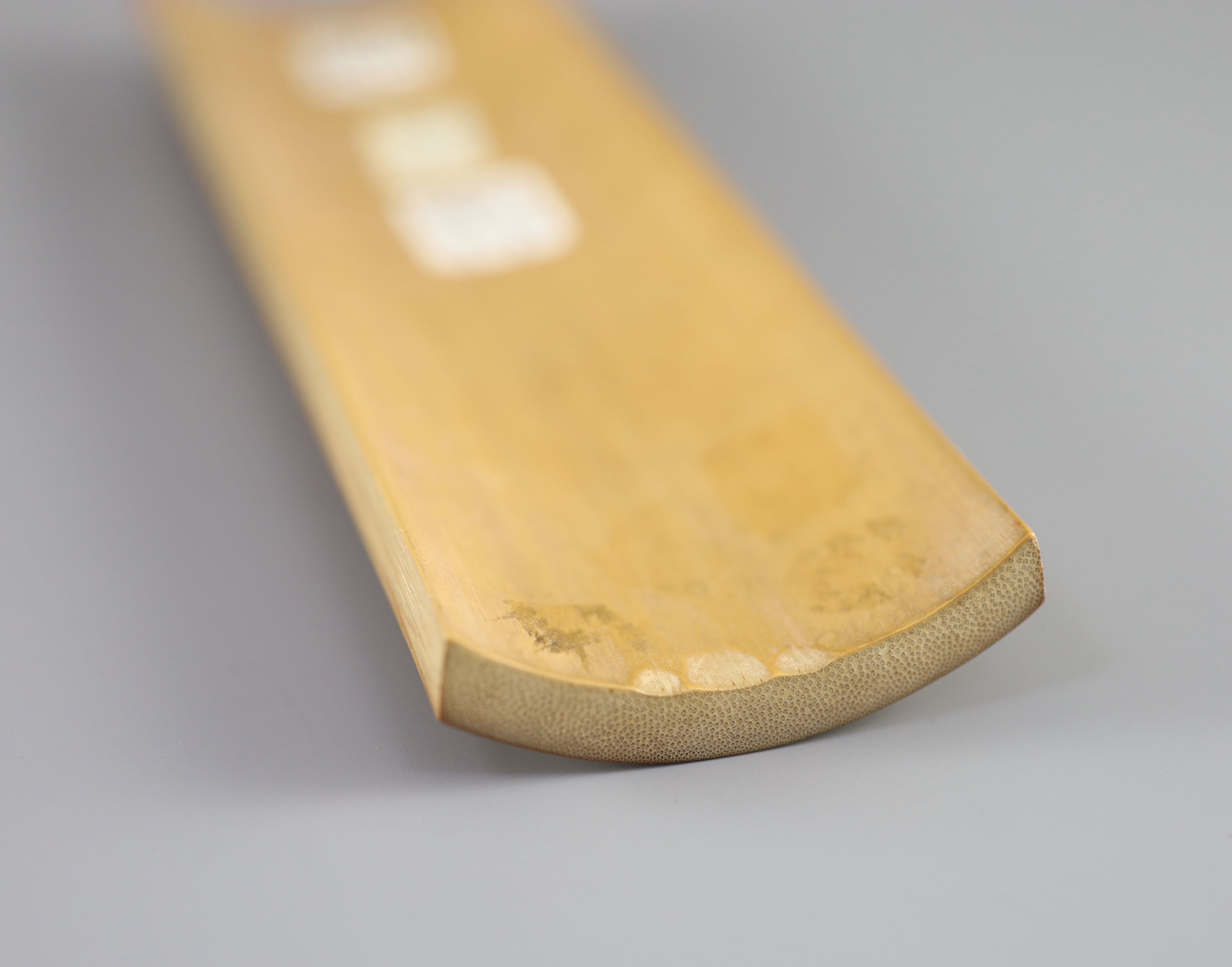 A Chinese carved bamboo wrist rest, Republic period, 22.7 cm long
